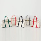 The Weekender Distressed Canvas Buckle Tote